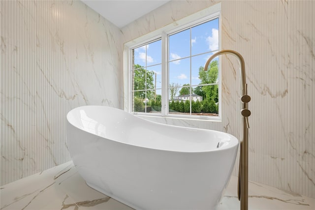 46 Snapdragon Ln, Roslyn Heights, NY 11577 - full bathroom featuring marble tiled floors and a freestanding tub