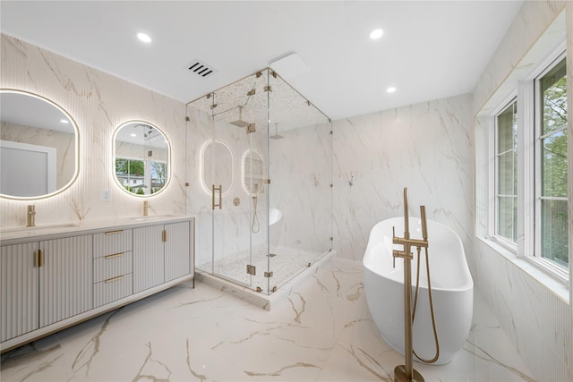 46 Snapdragon Ln, Roslyn Heights, NY 11577 - bathroom featuring marble tiled floors, a marble finish shower, a freestanding bath, double vanity, and recessed lighting
