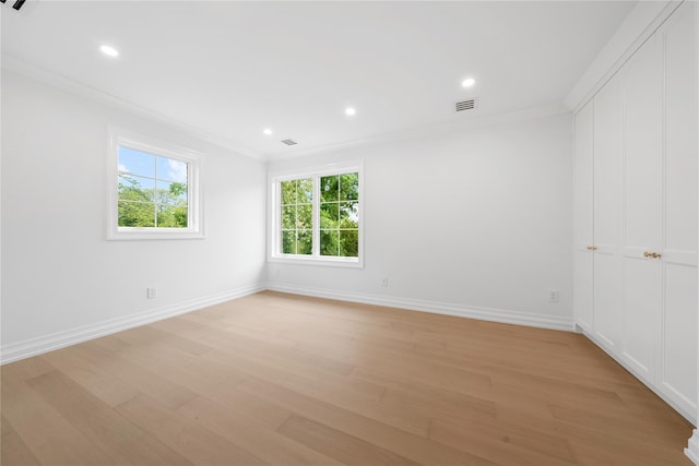 46 Snapdragon Ln, Roslyn Heights, NY 11577 - spare room featuring crown molding, light wood-style floors, baseboards, and recessed lighting