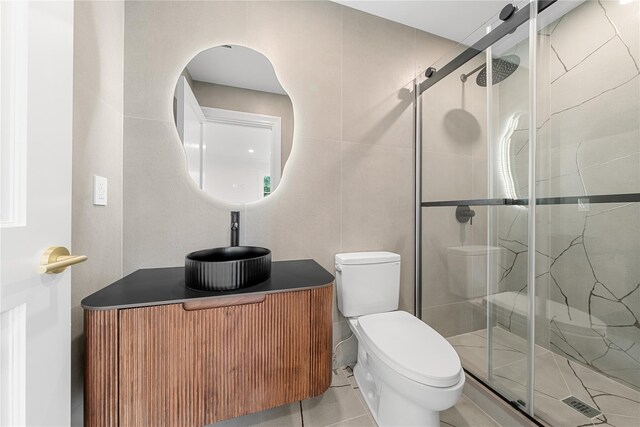 46 Snapdragon Ln, Roslyn Heights, NY 11577 - full bathroom featuring toilet, a shower stall, tile patterned flooring, and tile walls