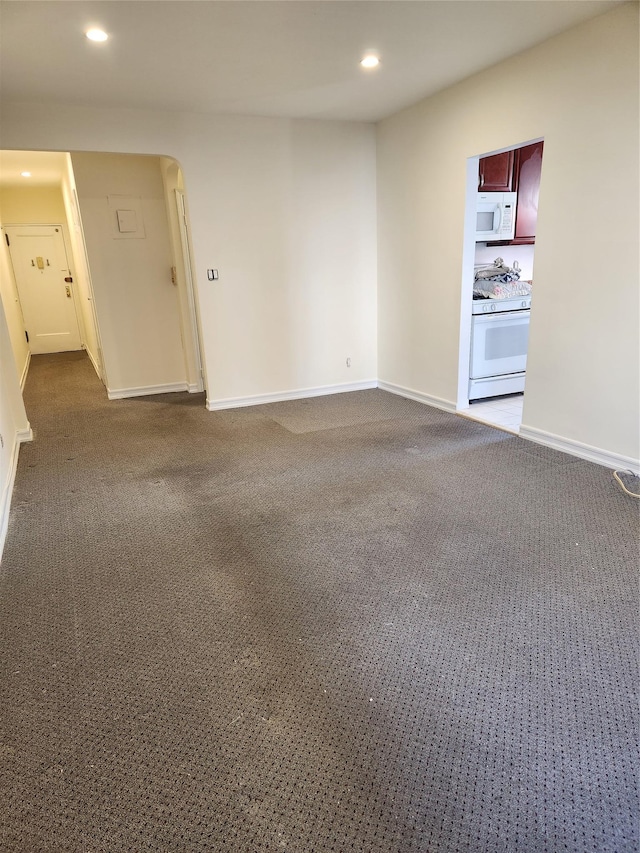 285 Central Ave Unit B4, Lawrence, NY 11559 - spare room with recessed lighting, dark colored carpet, baseboards, and arched walkways