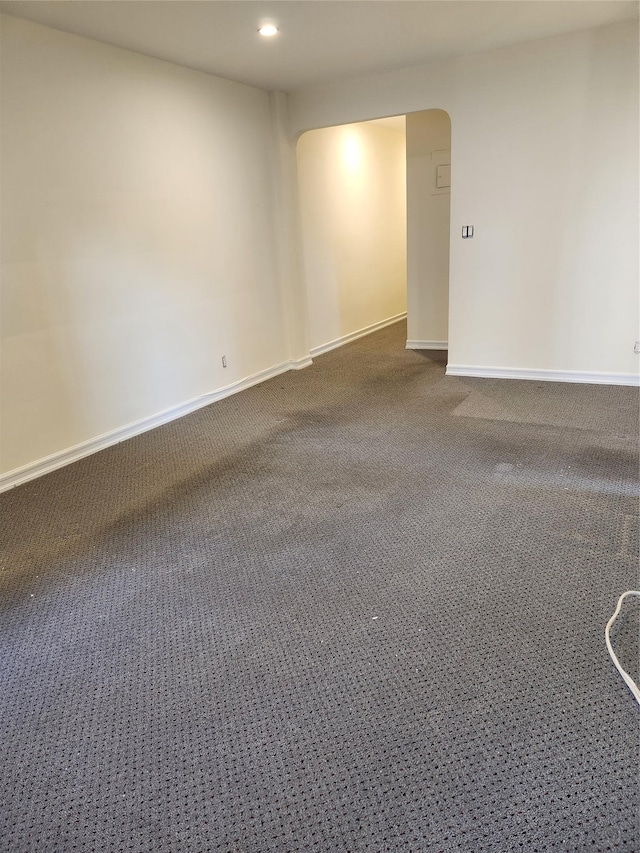 285 Central Ave Unit B4, Lawrence, NY 11559 - carpeted empty room featuring arched walkways, baseboards, and recessed lighting