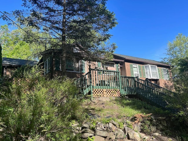 57 Empire Dr, Patterson, NY 12563 - rear view of house featuring a wooden deck and stairs
