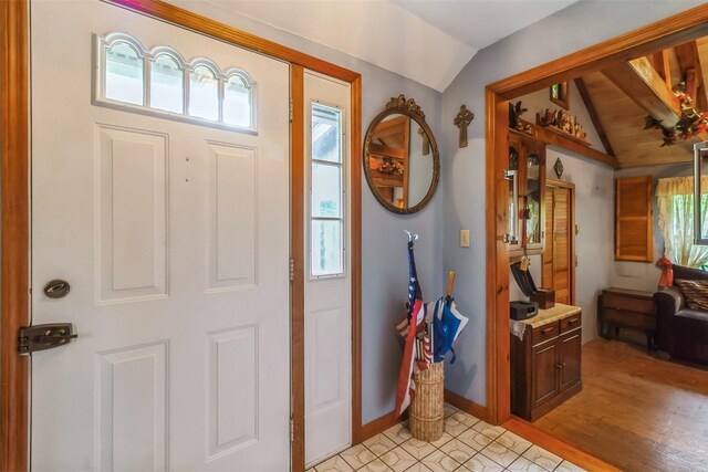 57 Empire Dr, Patterson, NY 12563 - entryway featuring vaulted ceiling, baseboards, and light wood-style flooring