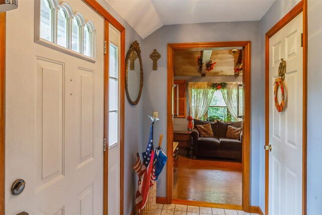 57 Empire Dr, Patterson, NY 12563 - foyer entrance featuring vaulted ceiling and baseboards