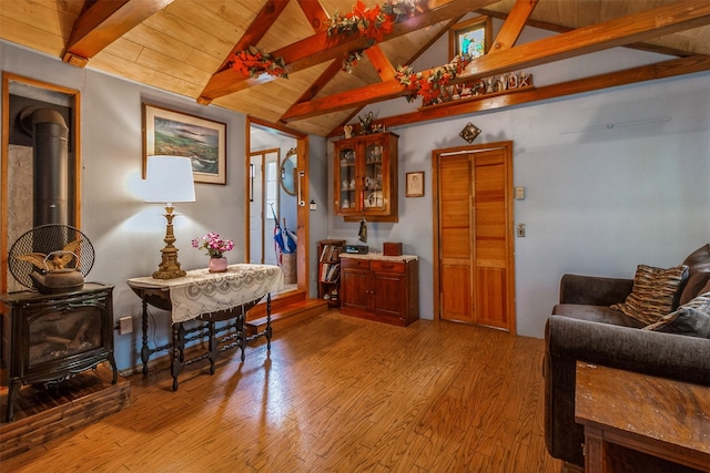 57 Empire Dr, Patterson, NY 12563 - living area with a wood stove, light wood-type flooring, and wood ceiling