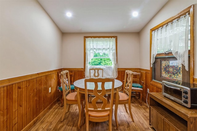 57 Empire Dr, Patterson, NY 12563 - dining room featuring wainscoting, wood finished floors, wood walls, and recessed lighting