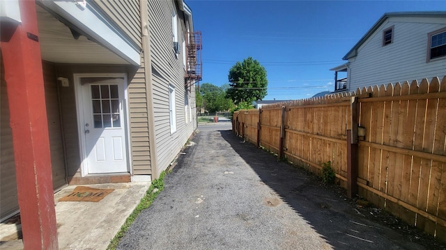 view of side of property featuring fence