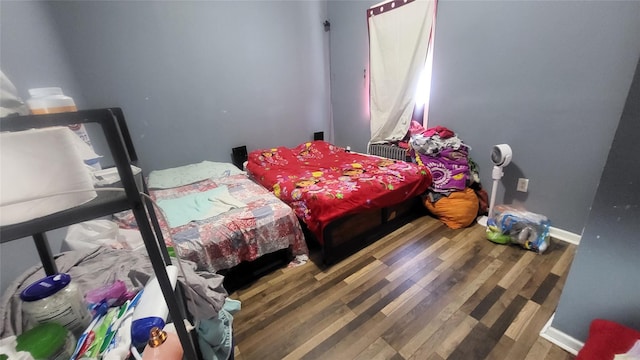 bedroom featuring wood finished floors