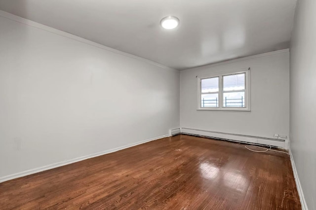4016 E Tremont Ave, Bronx, NY 10465 - spare room with a baseboard heating unit, ornamental molding, wood finished floors, and baseboards