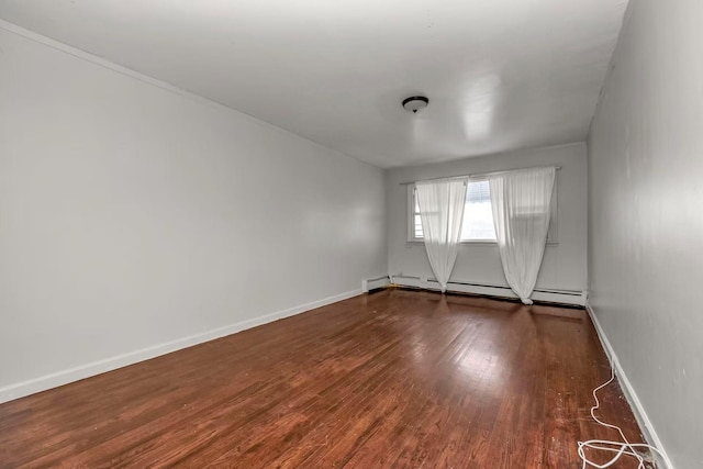 4016 E Tremont Ave, Bronx, NY 10465 - spare room with wood finished floors, a baseboard heating unit, and baseboards
