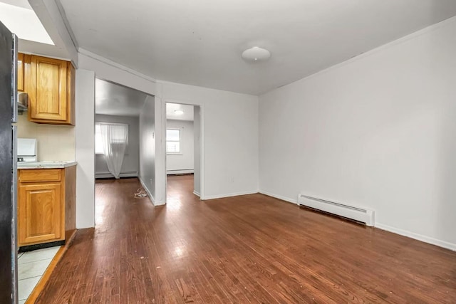 4016 E Tremont Ave, Bronx, NY 10465 - unfurnished living room featuring a baseboard heating unit, wood finished floors, baseboards, and ornamental molding