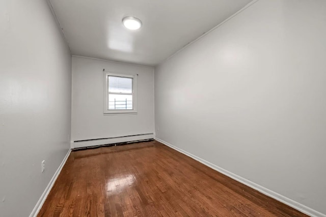 4016 E Tremont Ave, Bronx, NY 10465 - empty room with a baseboard heating unit, wood finished floors, and baseboards