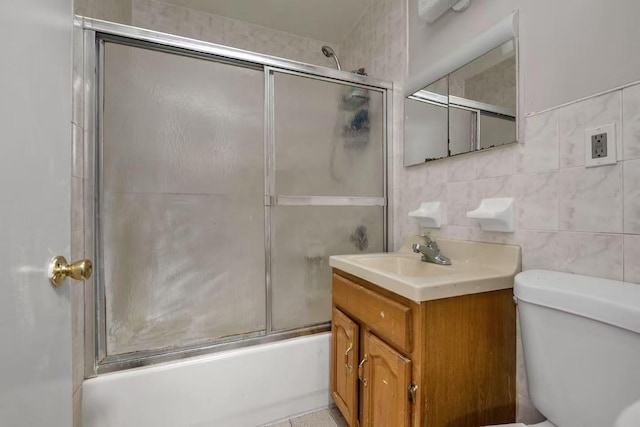 4016 E Tremont Ave, Bronx, NY 10465 - full bathroom featuring toilet, shower / bath combination with glass door, vanity, and tasteful backsplash