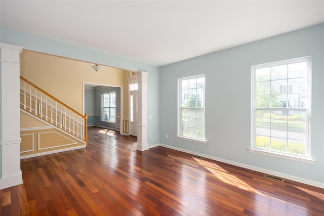 33 Avolet Ct, Mount Sinai, NY 11766 - foyer entrance featuring decorative columns, hardwood / wood-style floors, plenty of natural light, and stairway