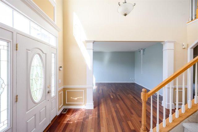 33 Avolet Ct, Mount Sinai, NY 11766 - foyer entrance with wood finished floors, stairway, and a wainscoted wall