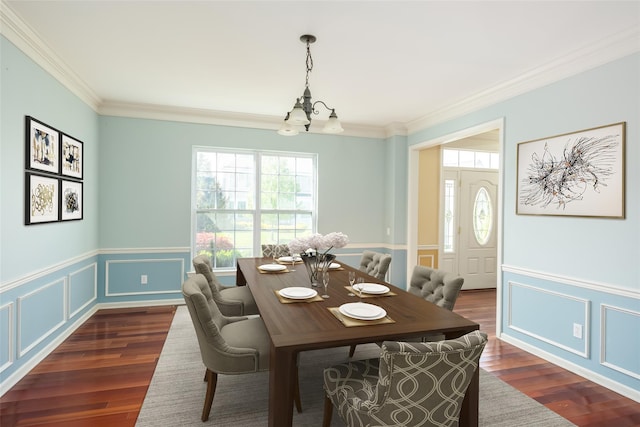 33 Avolet Ct, Mount Sinai, NY 11766 - dining area featuring a chandelier, healthy amount of natural light, crown molding, dark wood finished floors, and a decorative wall