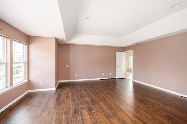 33 Avolet Ct, Mount Sinai, NY 11766 - spare room with a raised ceiling, dark wood-type flooring, baseboards, and recessed lighting