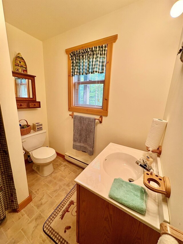 456 Anderson Rd, Parksville, NY 12768 - bathroom with toilet, a baseboard heating unit, vanity, and baseboards