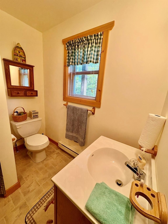 456 Anderson Rd, Parksville, NY 12768 - bathroom featuring a baseboard radiator, toilet, vanity, and baseboards