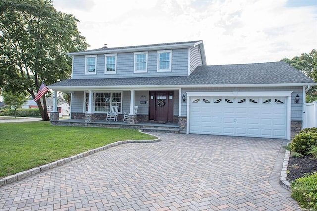 184 Dorothy Rd, West Islip, NY 11795 - view of front facade with decorative driveway, covered porch, and stone siding
