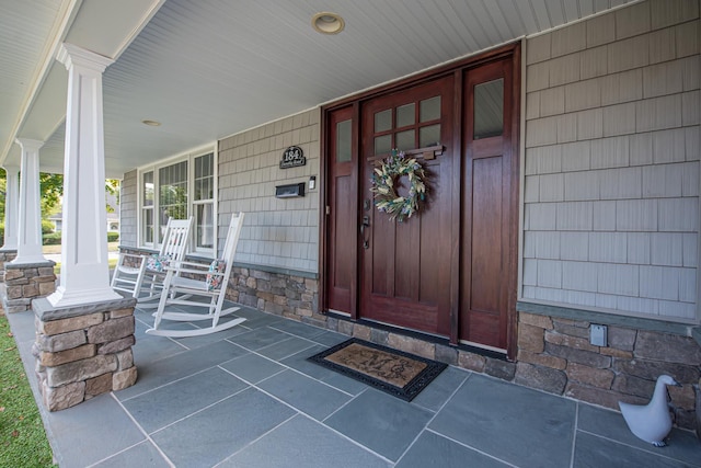 184 Dorothy Rd, West Islip, NY 11795 - doorway to property featuring a porch and stone siding