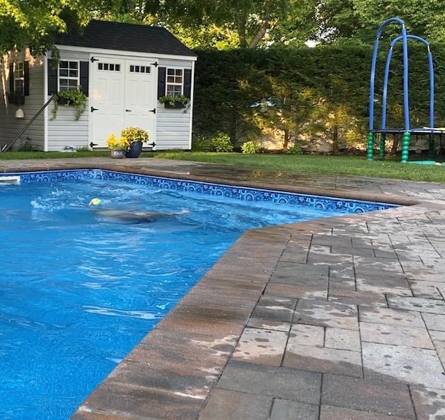 184 Dorothy Rd, West Islip, NY 11795 - swimming pool featuring an outbuilding and a shed