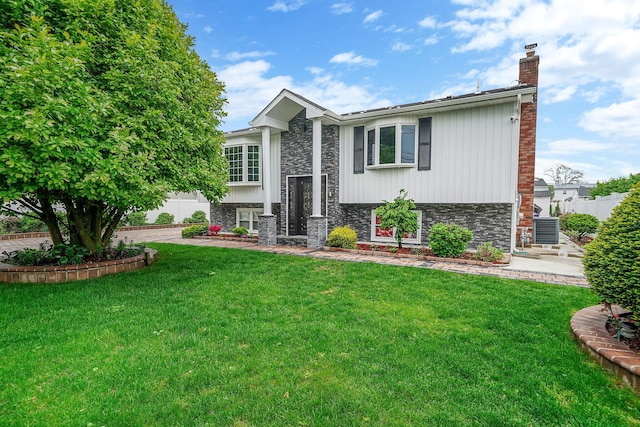 248 44th St, Lindenhurst, NY 11757 - bi-level home with a chimney and cooling unit