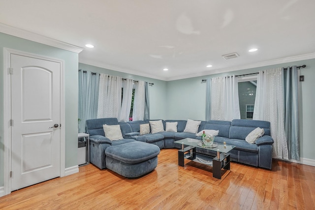 248 44th St, Lindenhurst, NY 11757 - living area with light wood finished floors, ornamental molding, recessed lighting, and baseboards
