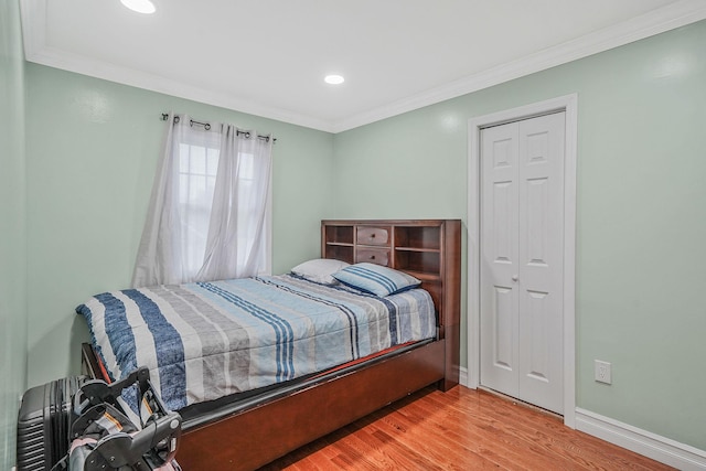 248 44th St, Lindenhurst, NY 11757 - bedroom with ornamental molding, wood finished floors, baseboards, a closet, and recessed lighting