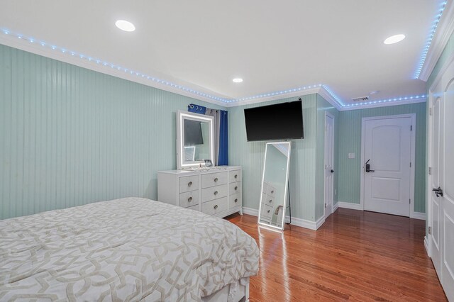 248 44th St, Lindenhurst, NY 11757 - bedroom featuring ornamental molding, wood finished floors, and baseboards