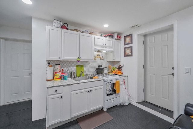 248 44th St, Lindenhurst, NY 11757 - kitchen with white range with gas stovetop, a sink, under cabinet range hood, white cabinets, and recessed lighting