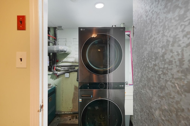 248 44th St, Lindenhurst, NY 11757 - washroom featuring stacked washer / dryer