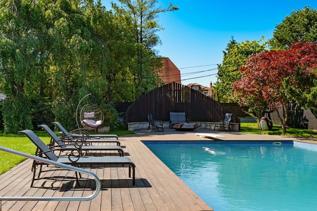 view of pool with a deck and a patio