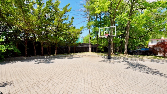 view of patio / terrace with basketball hoop
