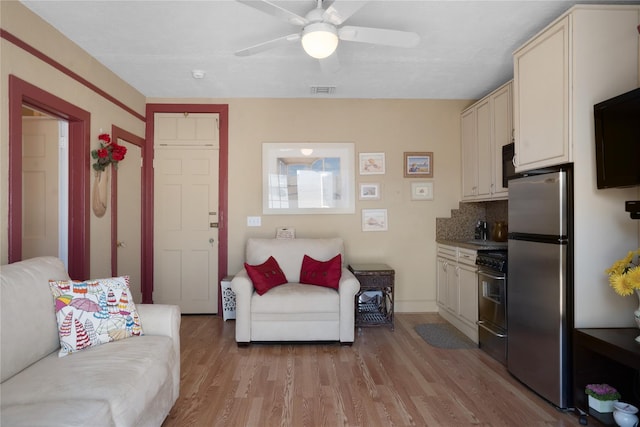 52 Main St Unit 6, Westhampton Beach, NY 11978 - living area with light wood finished floors and a ceiling fan