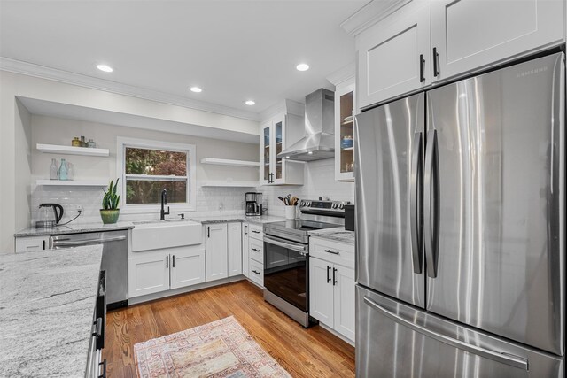 112 Edgehill Dr, Wappingers Falls, NY 12590 - kitchen with stainless steel appliances, wall chimney exhaust hood, open shelves, a sink, and white cabinetry