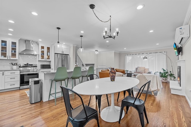 112 Edgehill Dr, Wappingers Falls, NY 12590 - dining area featuring ornamental molding, light wood-style floors, recessed lighting, and a chandelier
