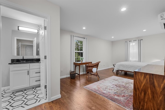 112 Edgehill Dr, Wappingers Falls, NY 12590 - bedroom featuring a sink, light wood-style floors, baseboards, and recessed lighting