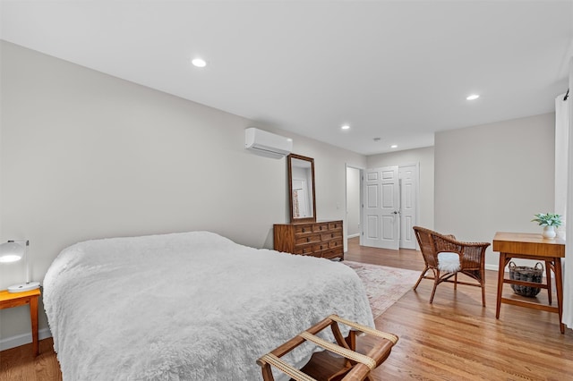 112 Edgehill Dr, Wappingers Falls, NY 12590 - bedroom with a wall mounted AC, light wood-style flooring, baseboards, and recessed lighting