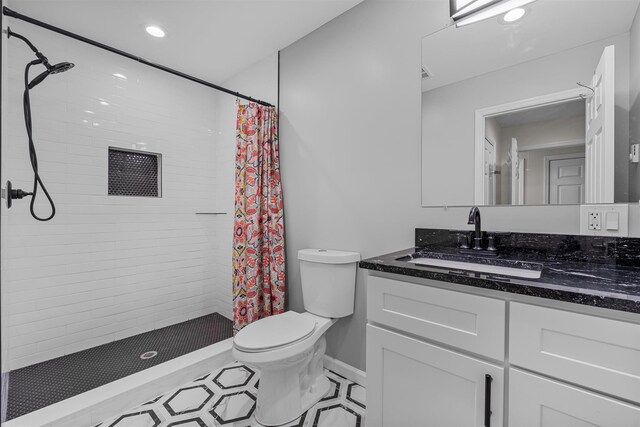 112 Edgehill Dr, Wappingers Falls, NY 12590 - bathroom featuring vanity, toilet, tiled shower, recessed lighting, and baseboards