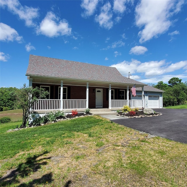 111 Cream St, Poughkeepsie, NY 12601 - view of front of property with a porch, a garage, driveway, and a front yard