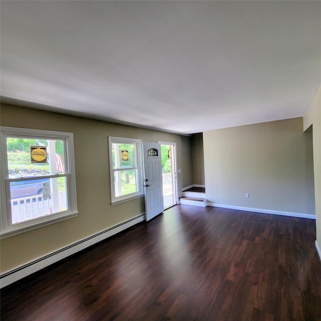 111 Cream St, Poughkeepsie, NY 12601 - spare room with a baseboard heating unit, dark wood-style flooring, and baseboards