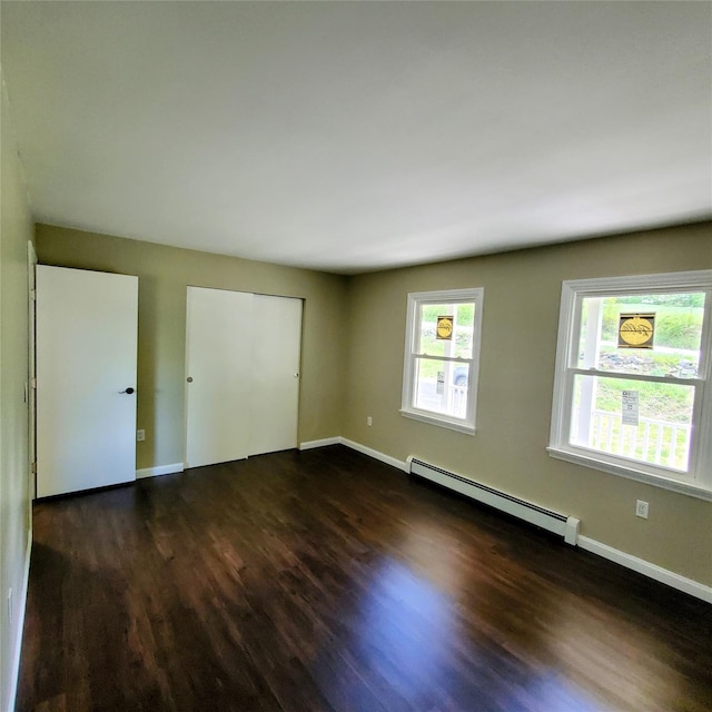 111 Cream St, Poughkeepsie, NY 12601 - unfurnished room featuring a baseboard heating unit, dark wood-style flooring, and baseboards