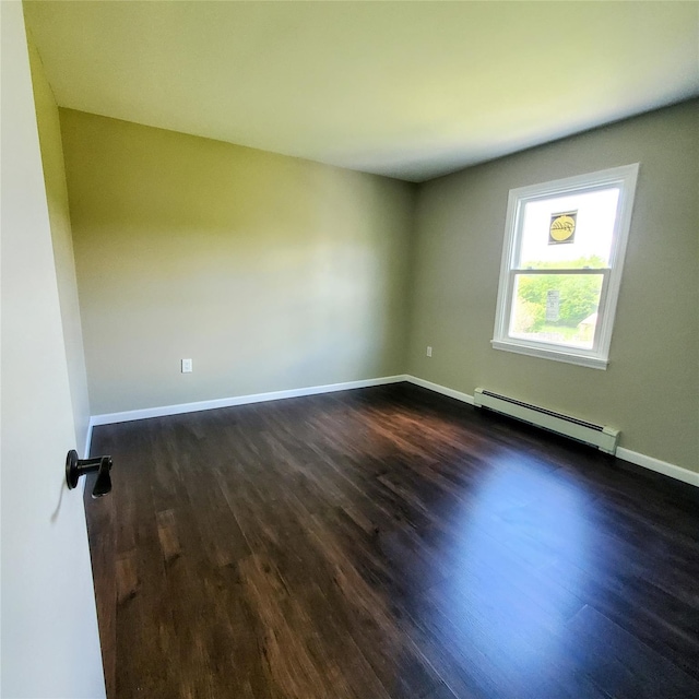 111 Cream St, Poughkeepsie, NY 12601 - empty room with a baseboard radiator, dark wood-style flooring, and baseboards