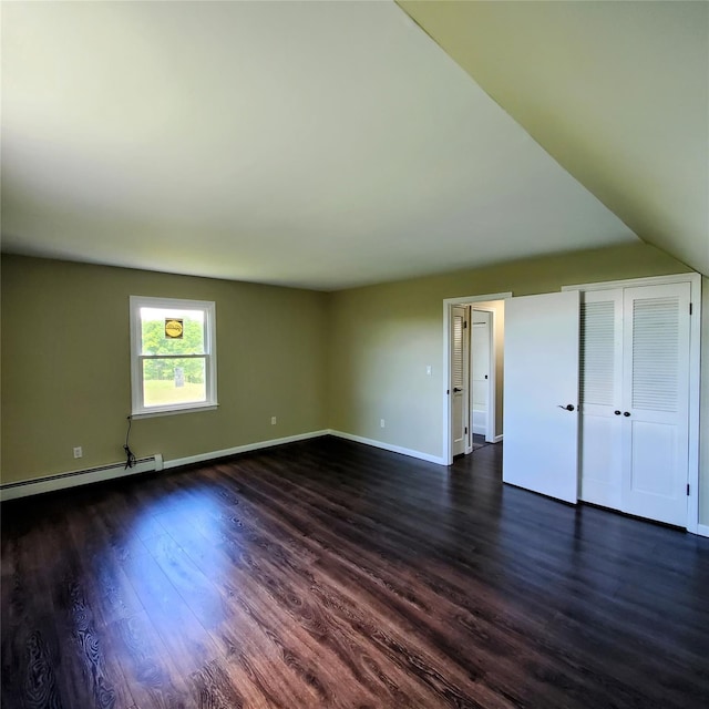 111 Cream St, Poughkeepsie, NY 12601 - unfurnished bedroom featuring baseboard heating, dark wood-style floors, and baseboards