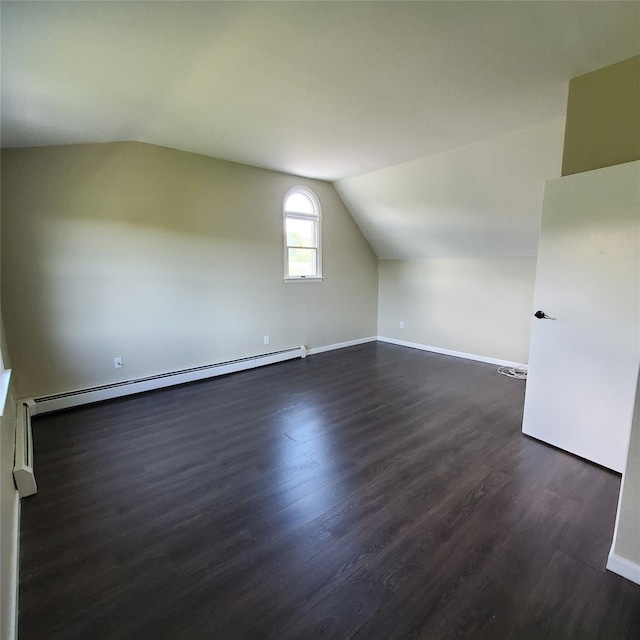 111 Cream St, Poughkeepsie, NY 12601 - bonus room featuring a baseboard heating unit, dark wood-style floors, vaulted ceiling, and baseboards