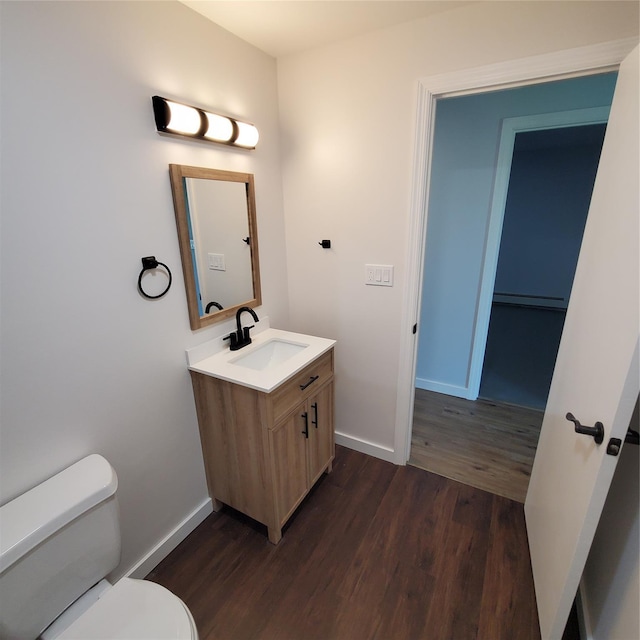 111 Cream St, Poughkeepsie, NY 12601 - half bath featuring toilet, wood finished floors, vanity, and baseboards
