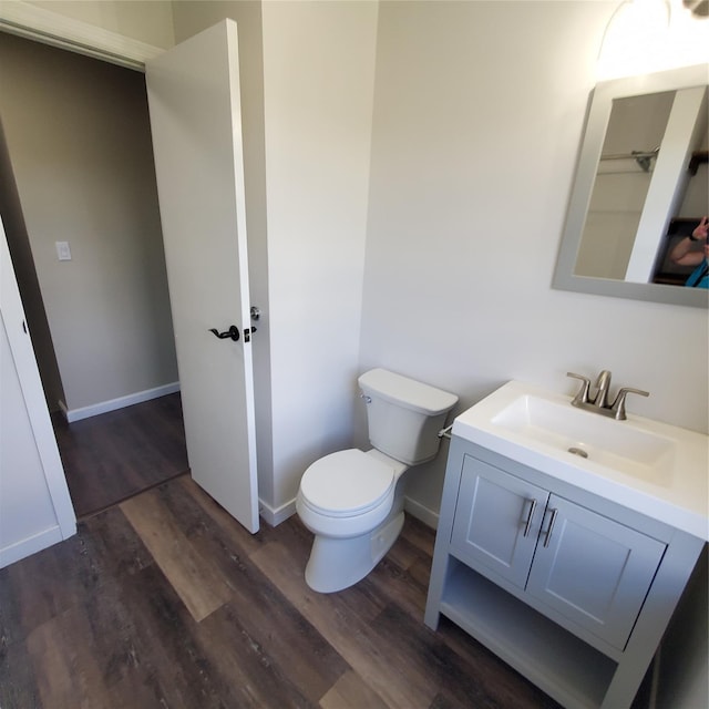 111 Cream St, Poughkeepsie, NY 12601 - bathroom featuring wood finished floors, vanity, toilet, and baseboards