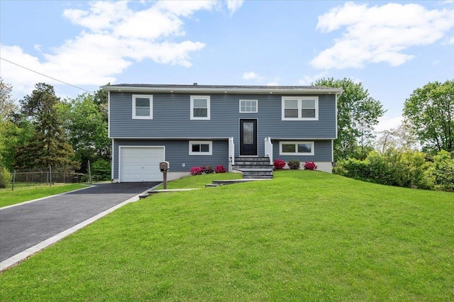 8 April Ave, Dix Hills, NY 11746 - bi-level home featuring driveway and an attached garage